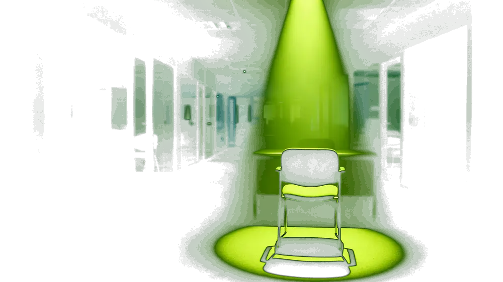 A dark corridor of glass-walled interview rooms at night, with one empty chair and a clean desk lit by a narrow volt-green spotlight